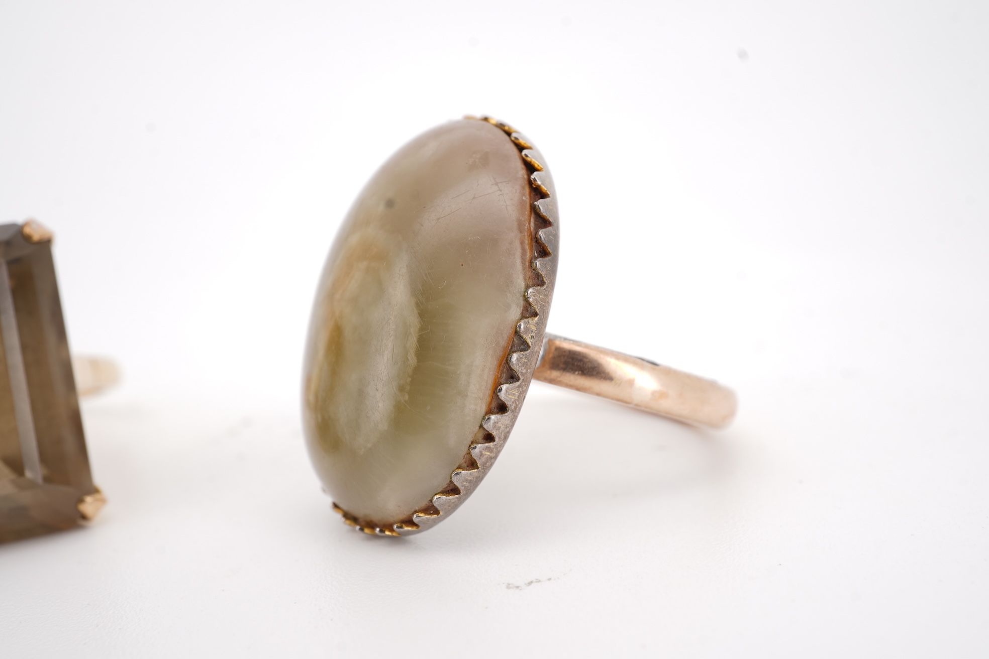 A modern 9ct gold and single stone emerald cut smoky quartz set ring, size N and one other 1960's 9ct gold shank, with a later added agate set white metal mount.